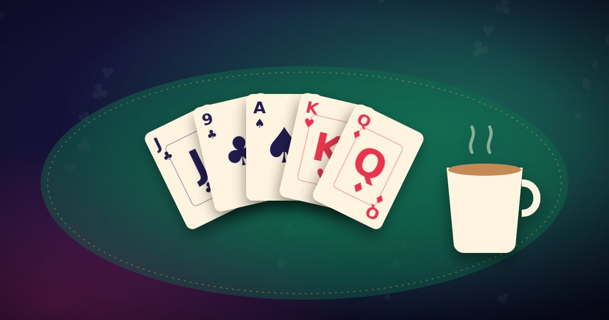 A friendly card game in Bangladesh: cards fanned beside a cup of milk tea